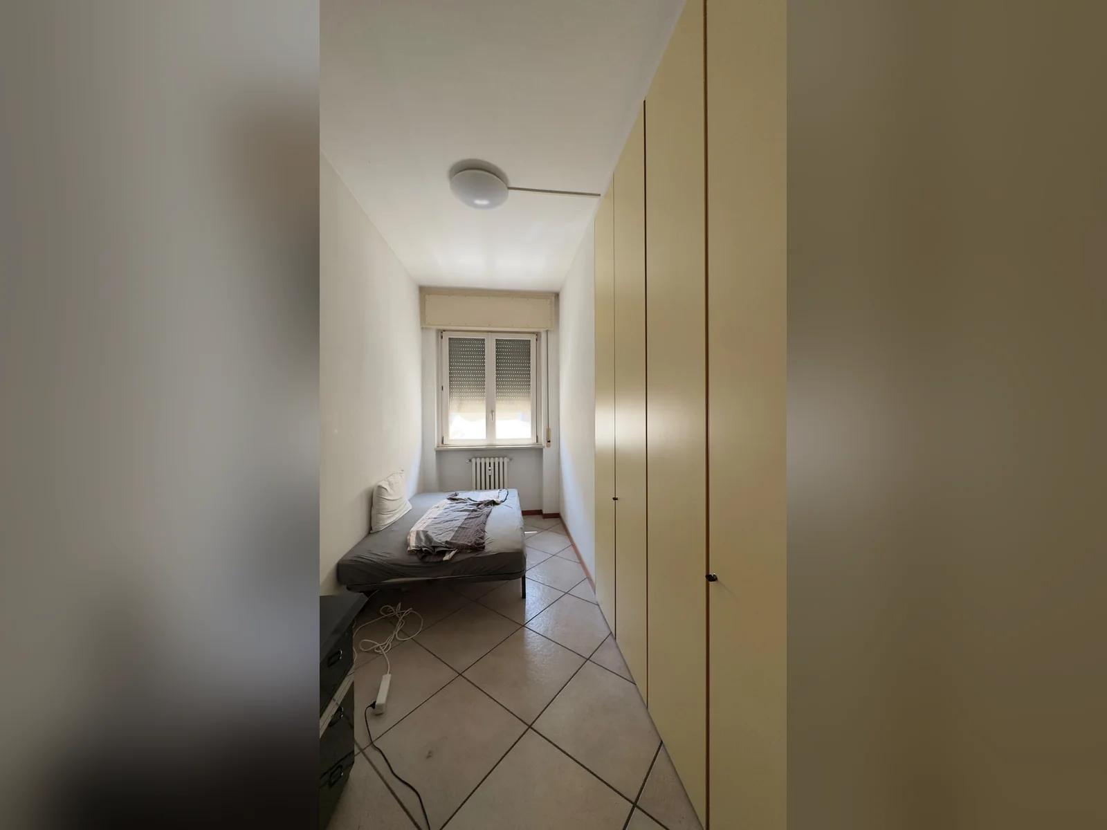 Compact San Pietro Room 2 with a single bed and full-height wardrobe