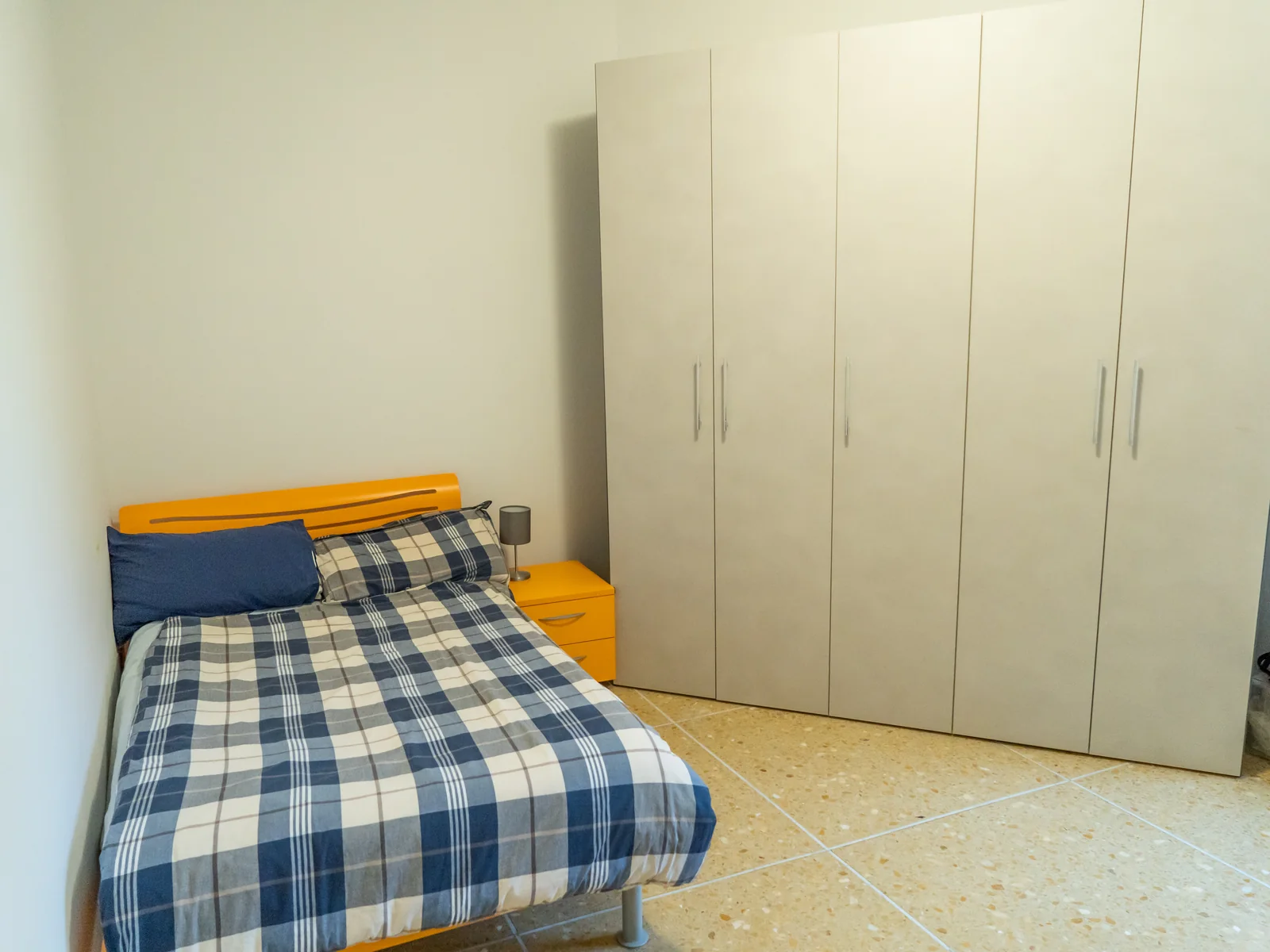 Vittoria Room 2 with a bed and full-height wardrobes